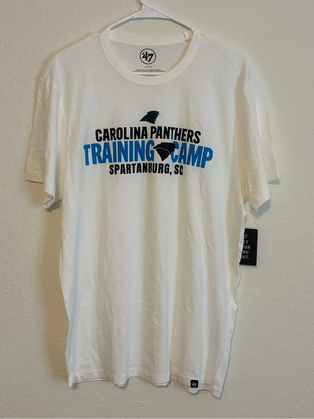 47 White Carolina Panthers Training Camp Tee with Blue and Black Graphics